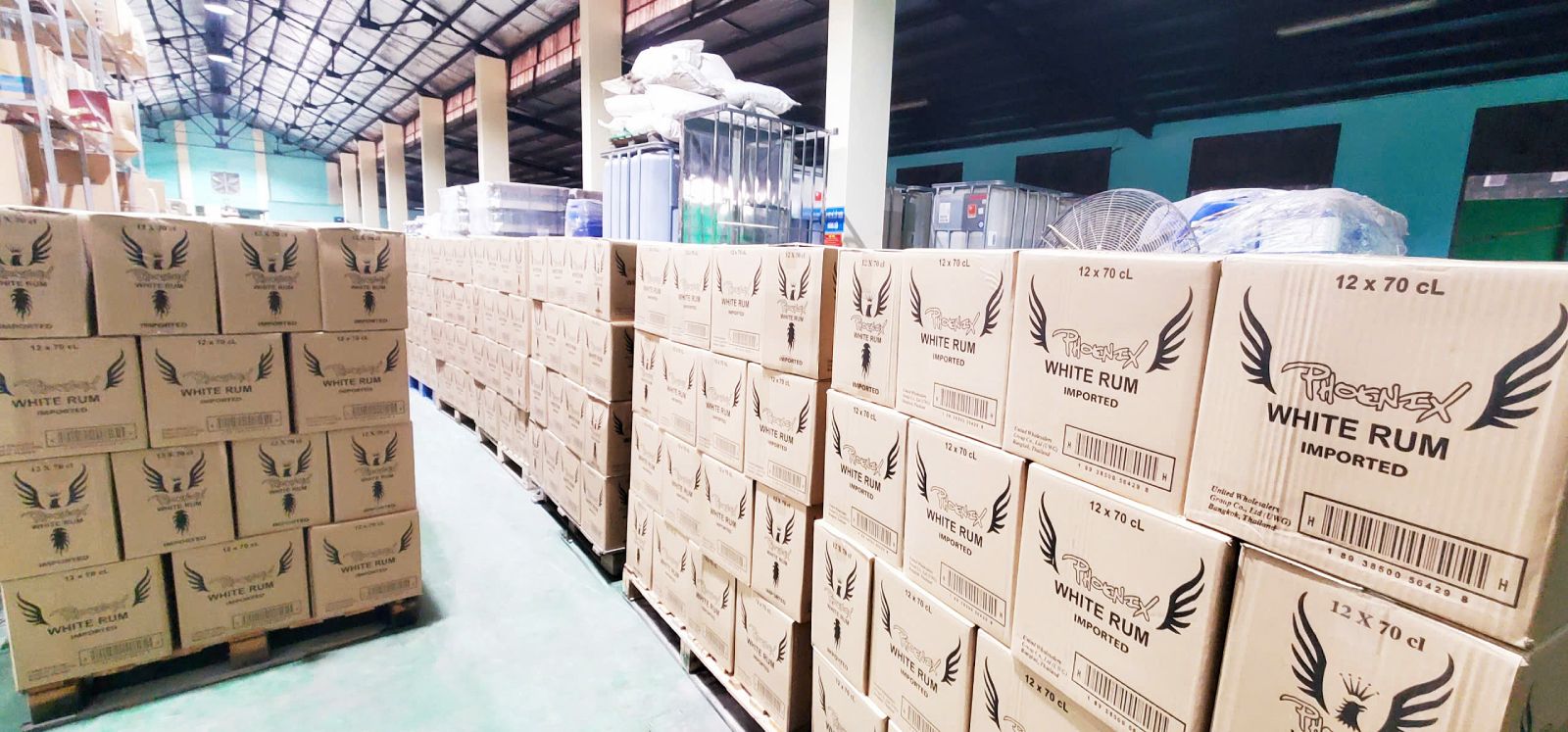 Export pallets of Phoenix White Rum bottled by La Martiniquaise Vietnam in Haiphong for ASEAN distribution